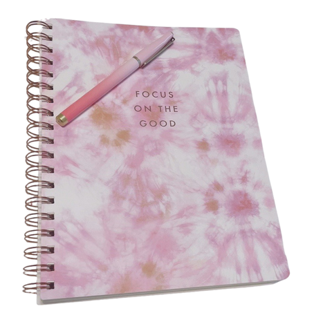pink notebook and pen