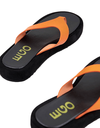 Ego Bayside chunky flip flops in orange | ASOS