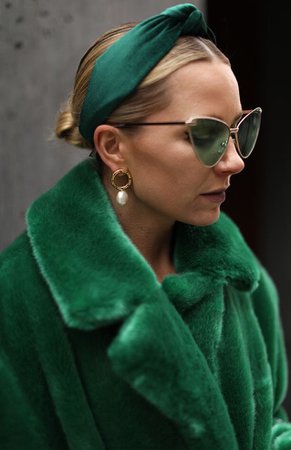 green headband and fur coat