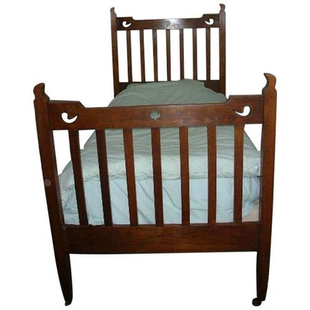 Liberty and Co. Attributed, an Arts and Crafts Oak Bed with Stylized Floral Cut-Outs For Sale at 1stDibs