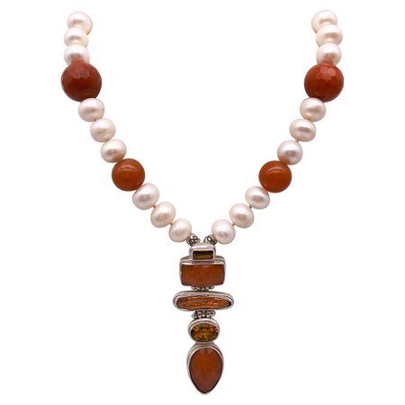 A.Jeschel 4 Stone Pendant suspended from Pearl and Aventurine necklace.