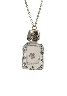 clear glass potion bottle with silver neckaces - Google Search