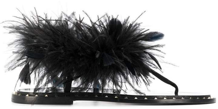 suede sandals with feather embellishments