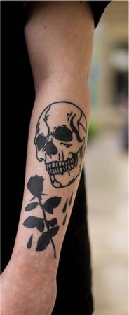 skull and rose arm tattoo