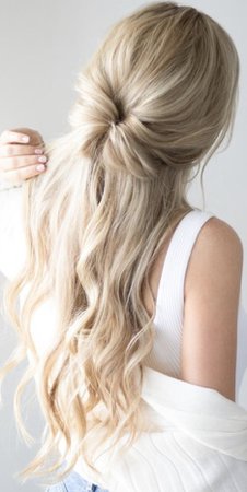 long wavy blonde hair with small pin up bun hairstyle
