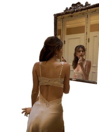 Coquette Girl Looking in Mirror Doing Feminine Makeup