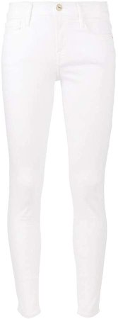 Le Color white mid rise skinny jeans