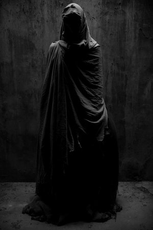 black cloaked figure