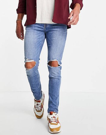ASOS DESIGN skinny jeans in mid wash with knee rips | ASOS