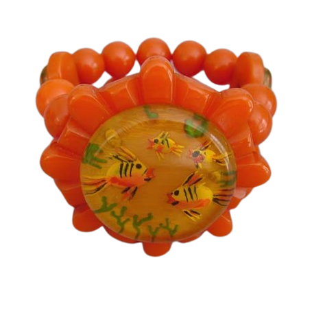 BAKELITE apple juice reverse carved and painted fishes center with round with orange beads stretchy bracelet