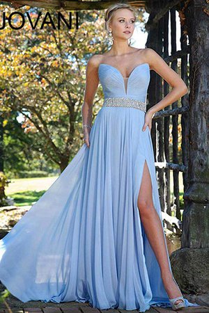 Soft blue floor length gown with crystal belt and thigh high slit.