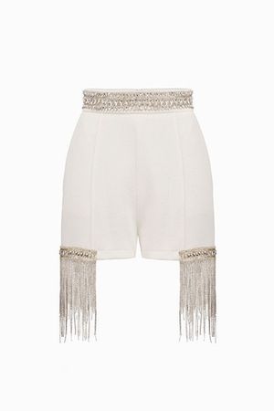 white beige shorts with gold chains