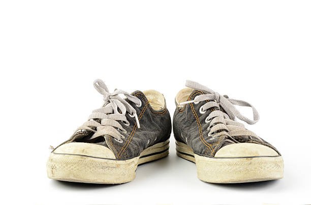 old grey distressed sneakers