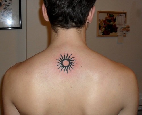 small sun tattoo guy