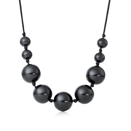 Elsa Peretti® Sphere necklace in black lacquer over Japanese hardwood. | Tiffany & Co.