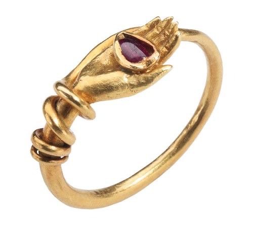 gold hand red jewel ring
