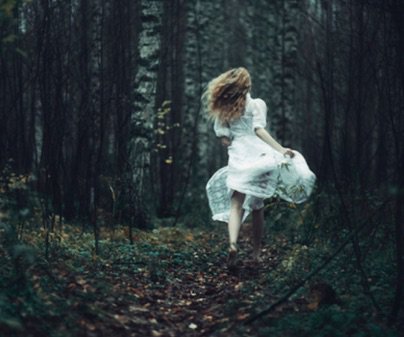 girl running through woods