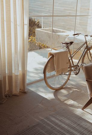 white bike near glass wall photo – Free Beige Image on Unsplash