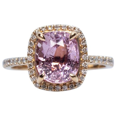 Estate Vintage 14 Karat Rose Gold Oval Pink Sapphire and Diamond Halo Ring For Sale at 1stdibs