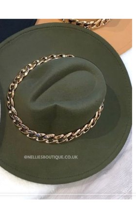 green hat with gold chain going out