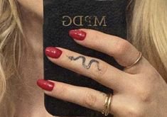 Dove Cameron snake finger tattoo