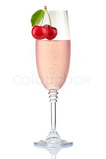 Glass of pink champagne with fresh cherry berries isolated | Stock Photo | Colourbox