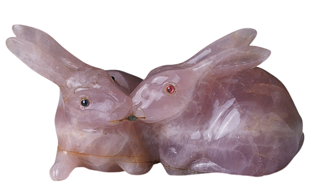 Two Cartier rabbits, rose quartz, eyes inset with cabochon sapphires and rubies.