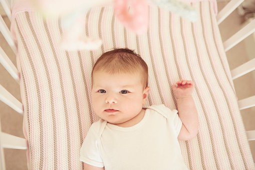 Baby Sleeping In Bed Stock Photo | Getty Images