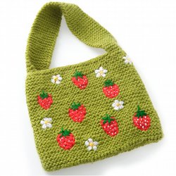green knitted bag with strawberries and daisies