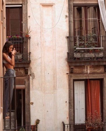 woman on european balcony