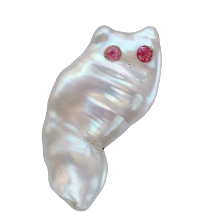 An owl-shaped blister pearl with ruby eyes. (online)