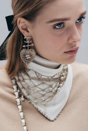 Model face makeup white pearls Chanel ellenium earrings necklace bandana