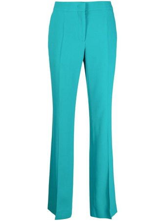 Moschino Flared mid-rise Trousers - Farfetch