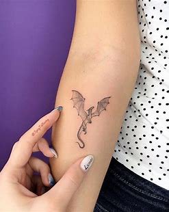 simple dragon right arm tattoo