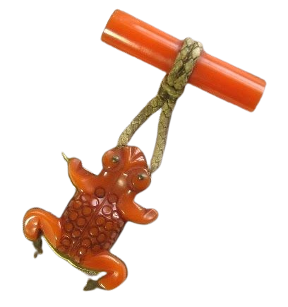 orange frog bakelite brooch