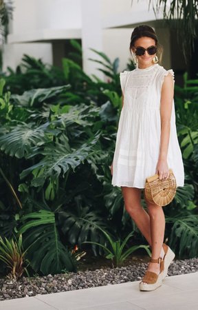 white dress, bamboo bag