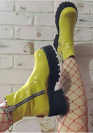 acid green boots with red fishnets