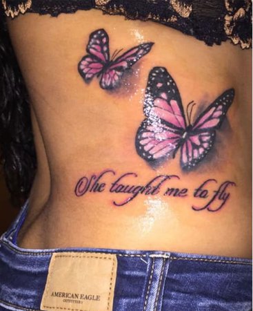 pink butterflies “she taught me how to fly” tattoo