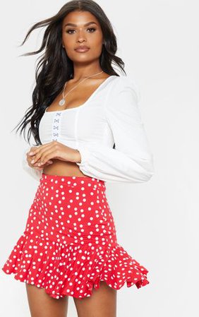 Red Polka Dot Frill Hem Mini Skirt | Skirts | PrettyLittleThing