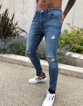 ASOS DESIGN spray on'vintage look' jeans with power stretch in dark wash blue with abrasions | ASOS