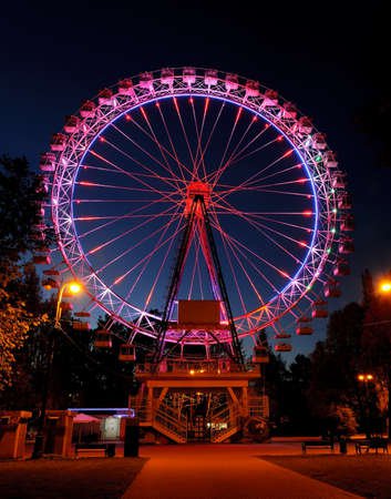 Amusement Park At Night - Big Ferris Wheel With Festive Purple.. Stock Photo, Picture And Royalty Free Image. Image 101615852.