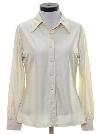 Vintage Jonquil Seventies Disco Shirt: 70s -Jonquil- Womens cream qiana nylon button cuff longsleeve button up front disco shirt. Solid sheeny color with tapered fit. Fold over collar, no pockets and square hemline.
