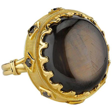 34.70 Carat Oval Black Star Sapphire and .28 Carats Black Diamonds 18k Gold Ring For Sale at 1stdibs