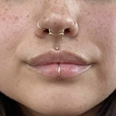 nose and lip piercing