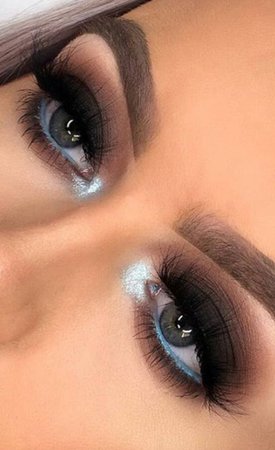 black with blue liner , eye makeup
