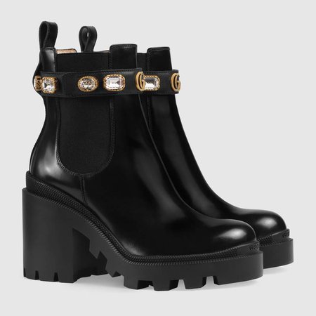 Black leather ankle boot with belt