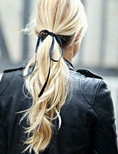 Blonde pony tail with black ribbon bow