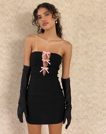 black dress with pink bows and black gloves