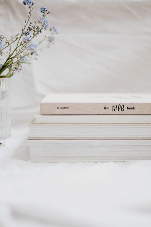 white and brown book on white textile photo – Free Image on Unsplash