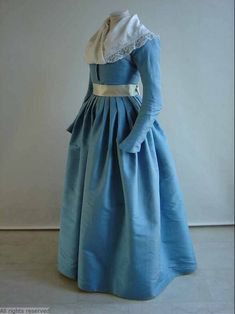 Levite or round gown, The Netherlands, 1780-1800. Sky blue silk taffeta with a light blue silk sash.